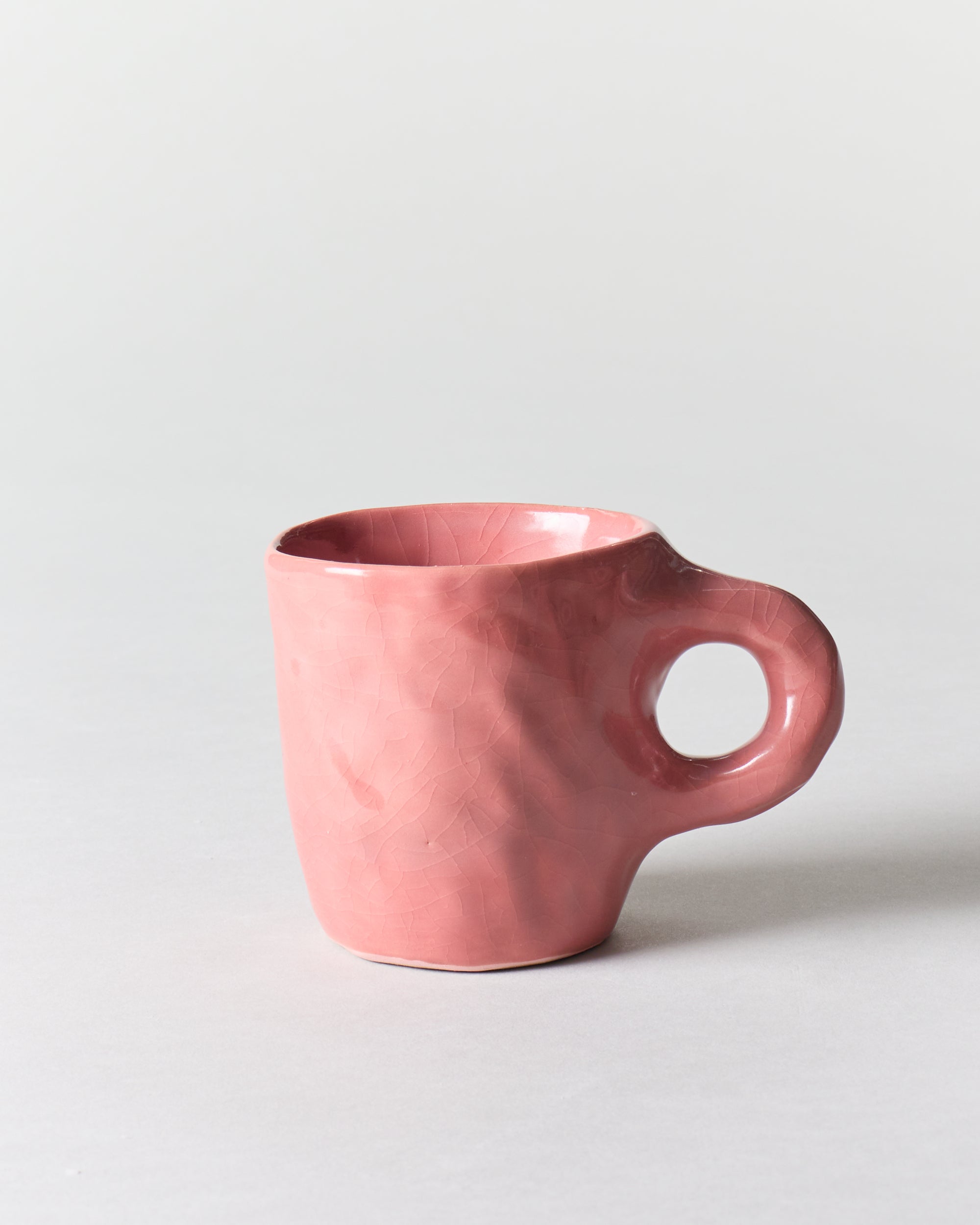 http://shopgoodfriend.com/cdn/shop/files/jade-paton-tall-mug-in-pink-0165.jpg?v=1685368443