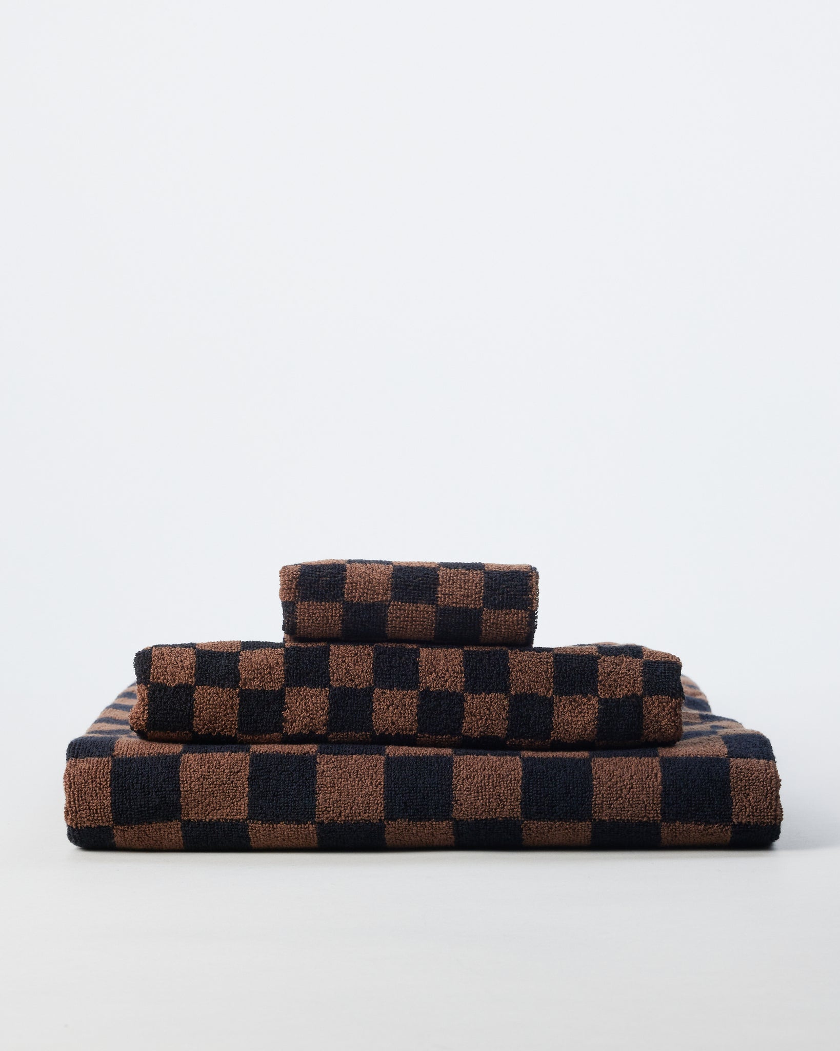 https://shopgoodfriend.com/cdn/shop/products/brown-and-black-checkered-towels-1208_2048x2048.jpg?v=1662054454